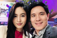 a man and woman posing for a selfie