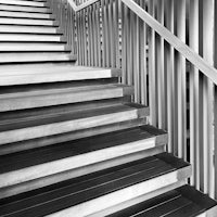a black and white photo of a staircase