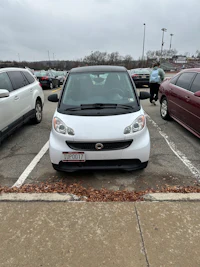 a white car parked in a parking lot