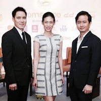 three asian men and women posing for a photo